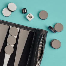 Load image into Gallery viewer, Close-up detail shot of luxury black leather travel backgammon set, showing leather backgammon board, white stitching, and leather pieces