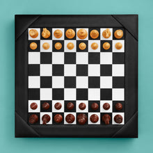 Load image into Gallery viewer, Luxury leather chessboard and checker set, shown with chess pieces on board. Black high-end leather board, beautiful wood carved pieces.