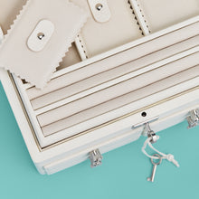 Load image into Gallery viewer, High-end leather jewelry box with 4 drawers. Cream white leather, detail shot of drawers and lock and key.