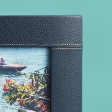 Load image into Gallery viewer, Navy blue leather picture frame with white stitching detail, holds 8x10" photo, close up of corner to show leather and stitching detail