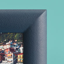 Load image into Gallery viewer, High-end leather picture frame, holds 5x5 photo, navy blue leather, close-up of corner shown to show leather detail