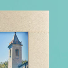 Load image into Gallery viewer, High-end leather picture frame with white contrast stitching. Holds 5x7" photo. Cream / white leather shown, close-up of corner shown with leather and stitching detail.