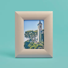 Load image into Gallery viewer, White / cream luxury leather picture frame, holds 5x7" photo, shown standing vertically