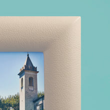 Load image into Gallery viewer, White / cream luxury leather picture frame, holds 5x7" photo, close up of corner to show cream pebbled leather