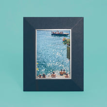 Load image into Gallery viewer, High-end leather picture frame with silver interior detail, holds 5x7 photo, navy blue leather, shown standing vertically