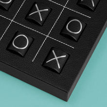 Load image into Gallery viewer, Luxury leather tic tac toe board with white stitching. Shown in black leather. Close-up of corner shown to show detail of high-quality leather and stitching.