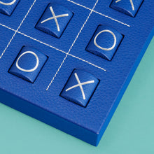 Load image into Gallery viewer, Luxury leather tic tac toe board with white stitching. Shown in blue leather. Close-up of corner shown.