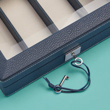 Load image into Gallery viewer, Luxury leather watch case, navy / blue with white stitching, space for 4 watches, close-up to show detail of stitching, leather, and lock and key.