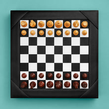 Load image into Gallery viewer, Luxury leather chessboard and checker set, shown with chess pieces on board. Black high-end leather board, beautiful wood carved pieces.
