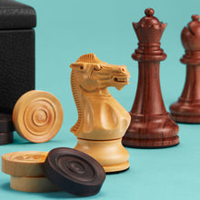Load image into Gallery viewer, High-end chess set, close up showing hand-carved wooden pieces. Black leather board shown in background.
