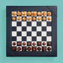 Load image into Gallery viewer, Luxury leather chessboard and checker set, shown with chess pieces on board. Navy high-end leather board, beautiful wood carved pieces.
