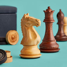 Load image into Gallery viewer, High-end chess set, close up showing hand-carved wooden pieces. Navy leather board shown in background.
