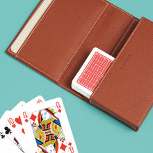 Load image into Gallery viewer, High-end leather game card case with white contrast stitching. Brown leather, shown open with playing cards (included).
