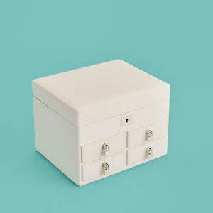 High-end leather jewelry box with 4 drawers. Cream white leather, shown closed.