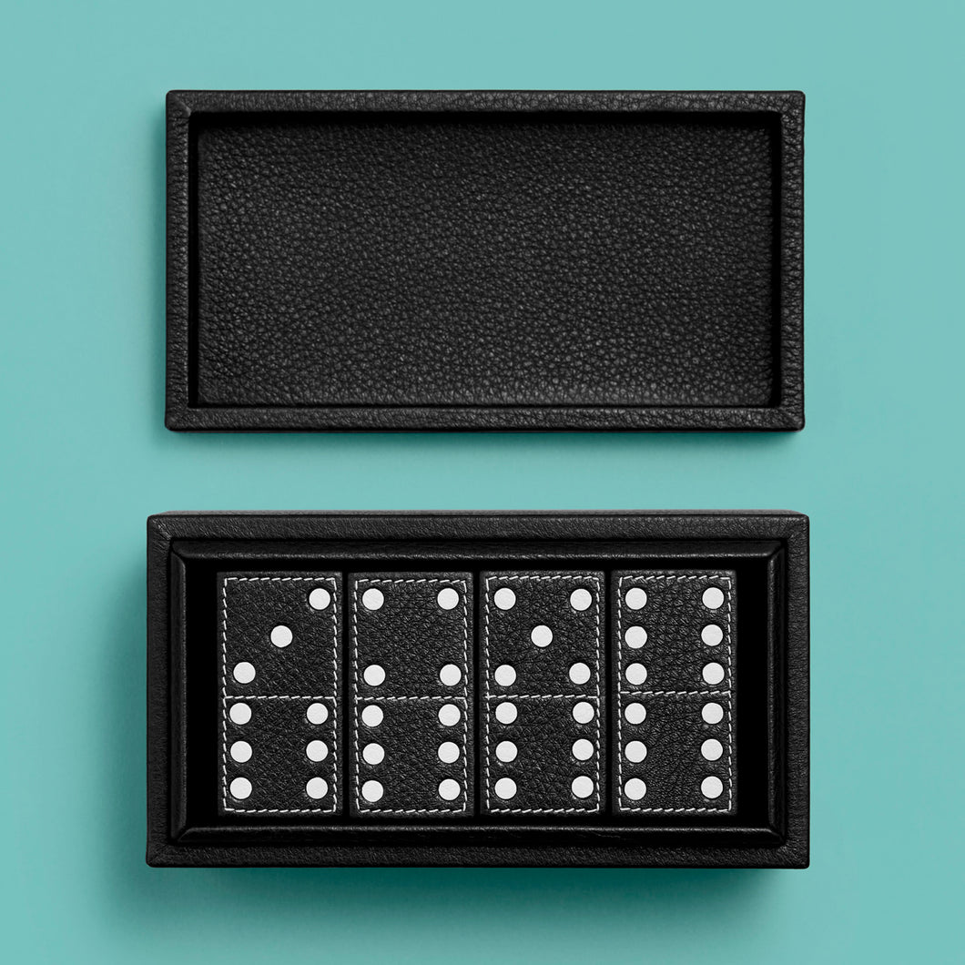 Luxury leather domino box with white contrast stitching, shown open to show four stacks of domino tiles.
