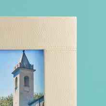 Load image into Gallery viewer, High-end leather picture frame with white contrast stitching. Holds 5x7&quot; photo. Cream / white leather shown, close-up of corner shown with leather and stitching detail.
