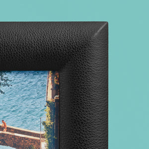 Black luxury leather picture frame, holds 5x7" photo, shown close-up to show detail of pebbled black leather