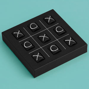Luxury leather tic tac toe board with white stitching. Shown in black leather.
