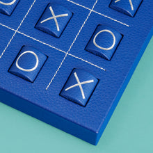 Load image into Gallery viewer, Luxury leather tic tac toe board with white stitching. Shown in blue leather. Close-up of corner shown.
