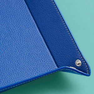 High-end leather valet tray, royal blue leather, corner shot to show detail of stitching and leather.